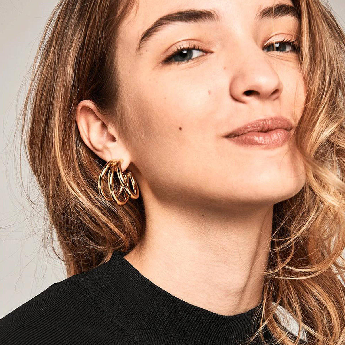 Thick Gold Chunky Hoop Earrings on display