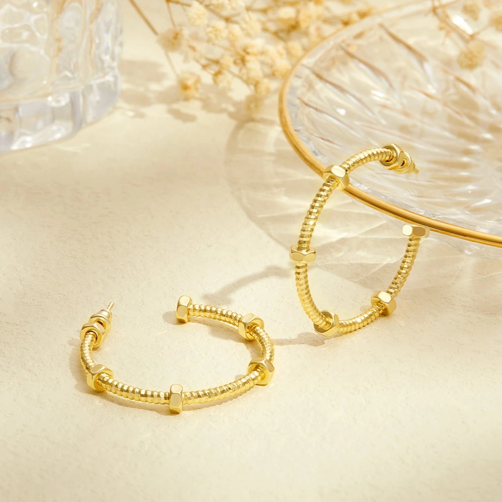 Detailed view of 14K Gold Twisted Huggie Hoops Earrings - Large Round Hoop
