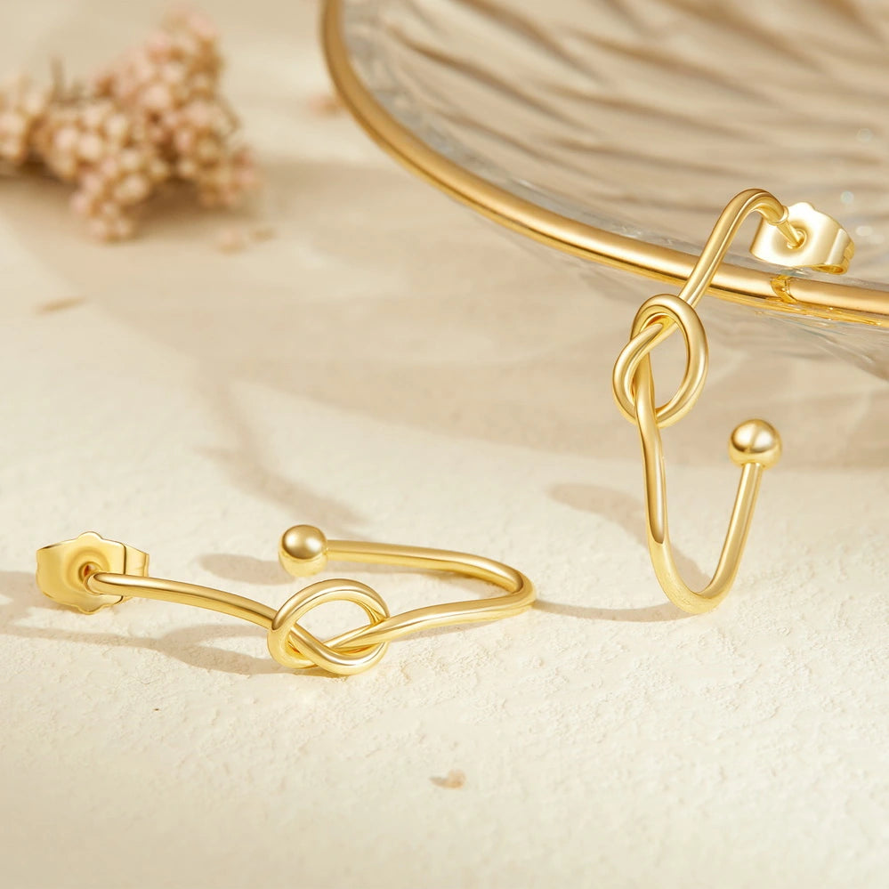 Detailed view of 14K Gold Twisted Huggie Hoops Earrings - Oval Hoop