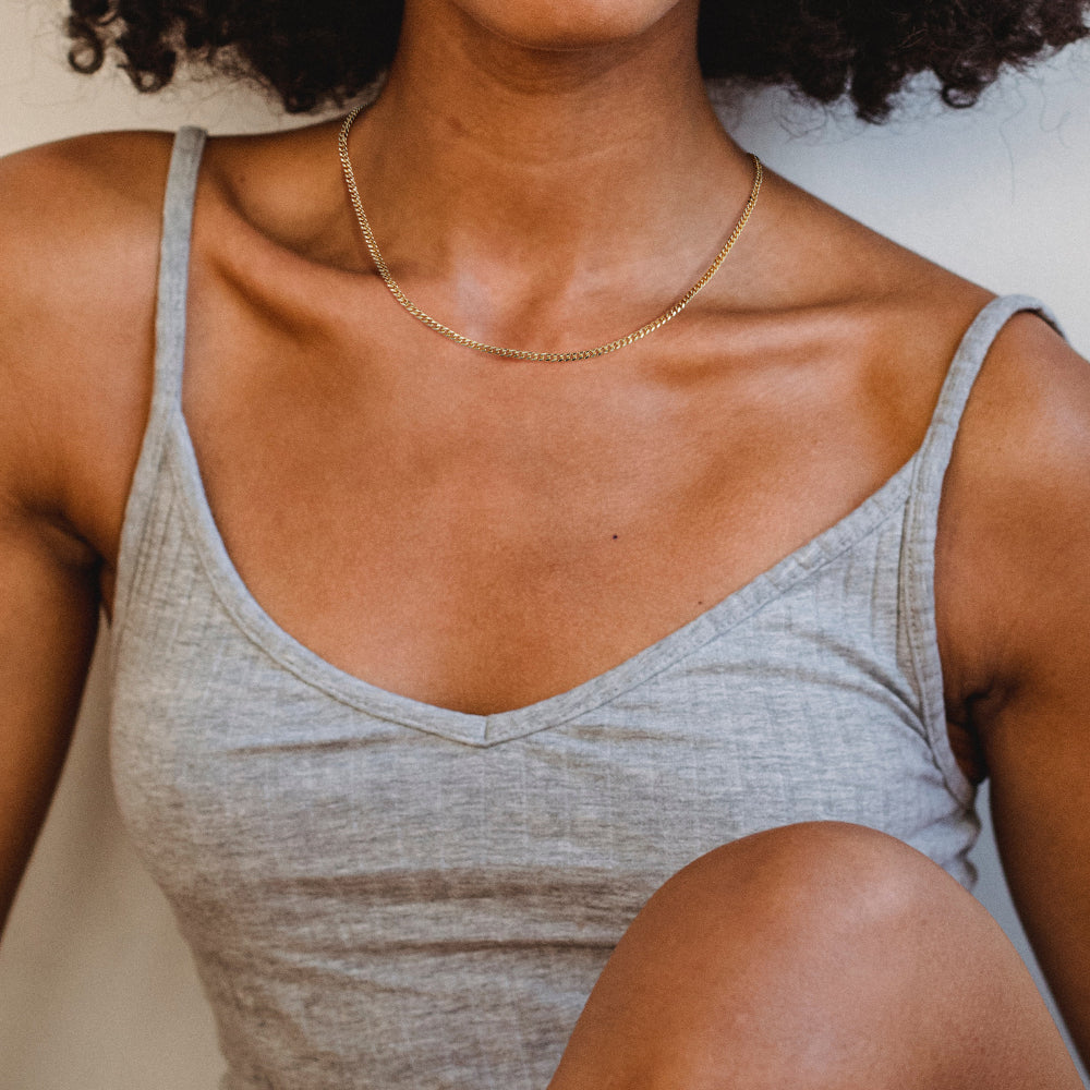 Close-up of 14K Gold Layered Necklaces - Cuban, 3mm Paperclip, Figaro