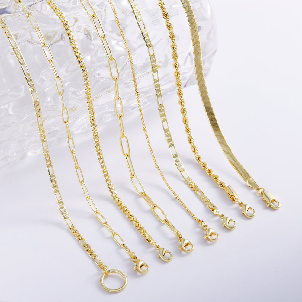 14K Gold Layered Necklaces - Cuban, Figaro, 4mm Paperclip on display